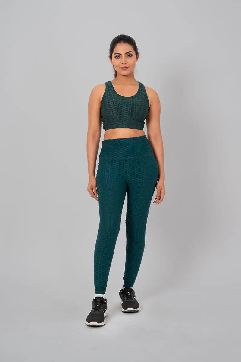 Woman in womens gym wear, bottle green coord set - full front view showcasing moisture-wicking textured fabric and high-waisted fit.