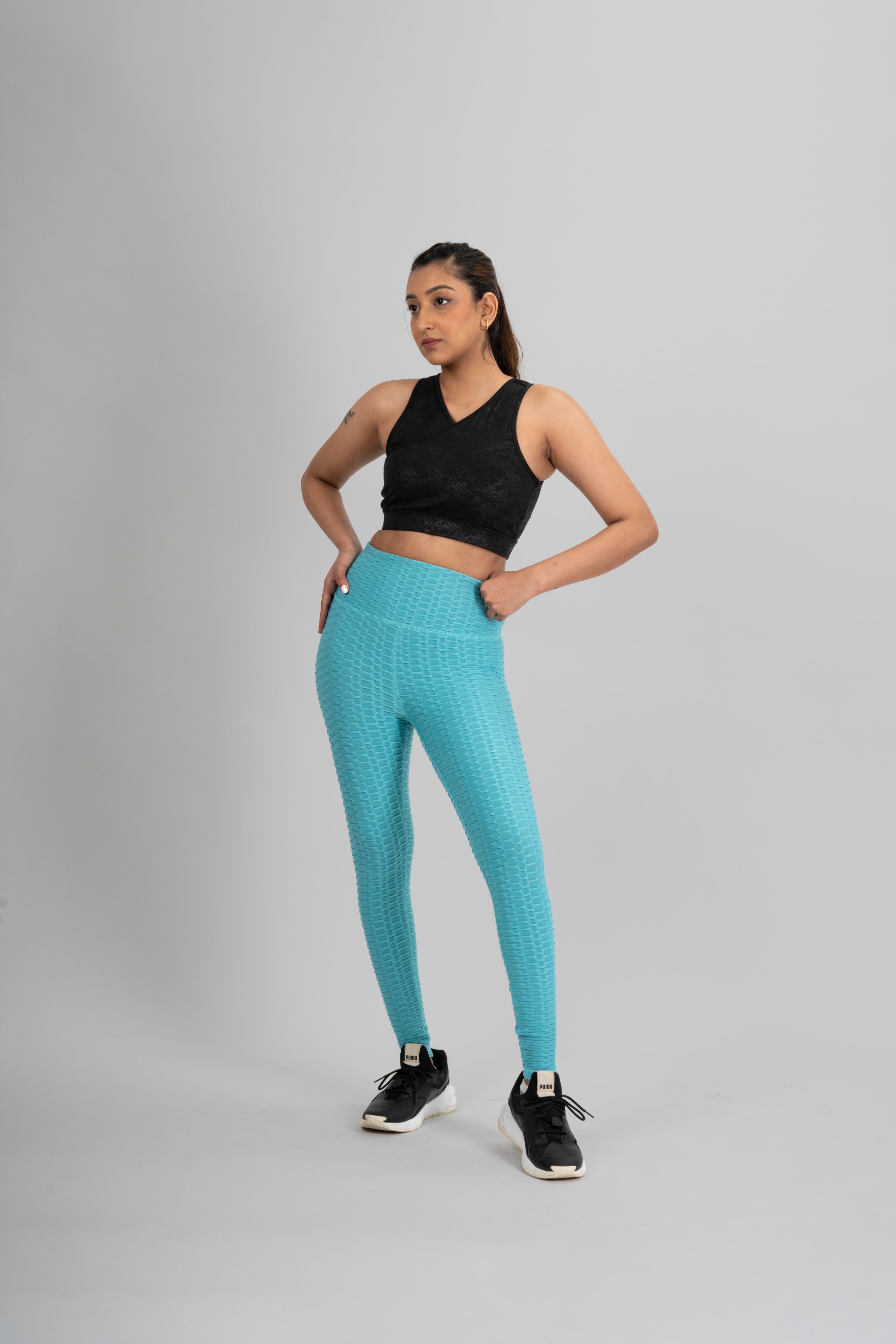 Woman in workout leggings, Aqua Blue - side view standing, showing breathable fabric and anti-camel toe feature.@@@color_Aqua-Blue