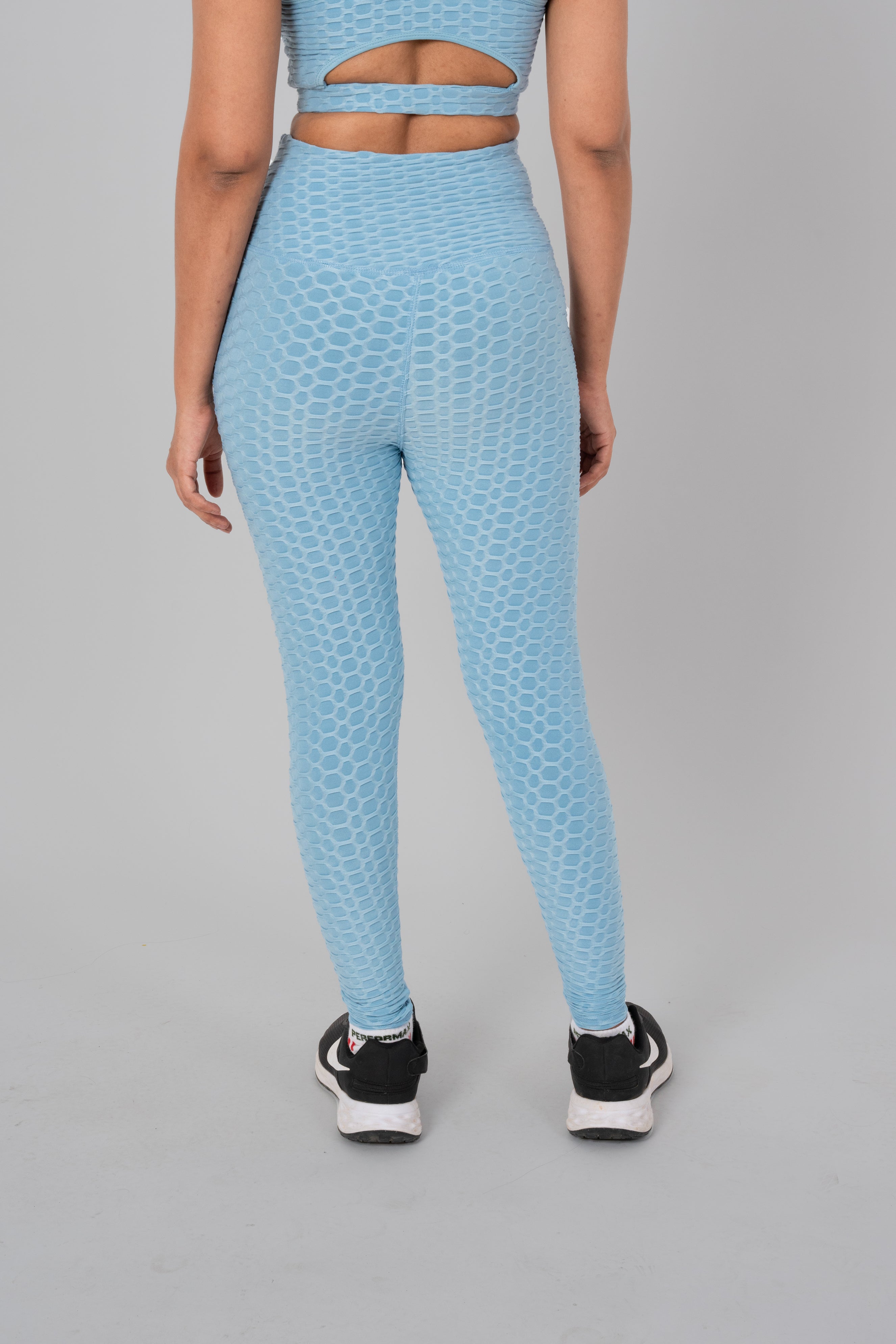 Woman in workout leggings, Sky Blue - back view showcasing and high-waisted support.@@@color_Sky-Blue