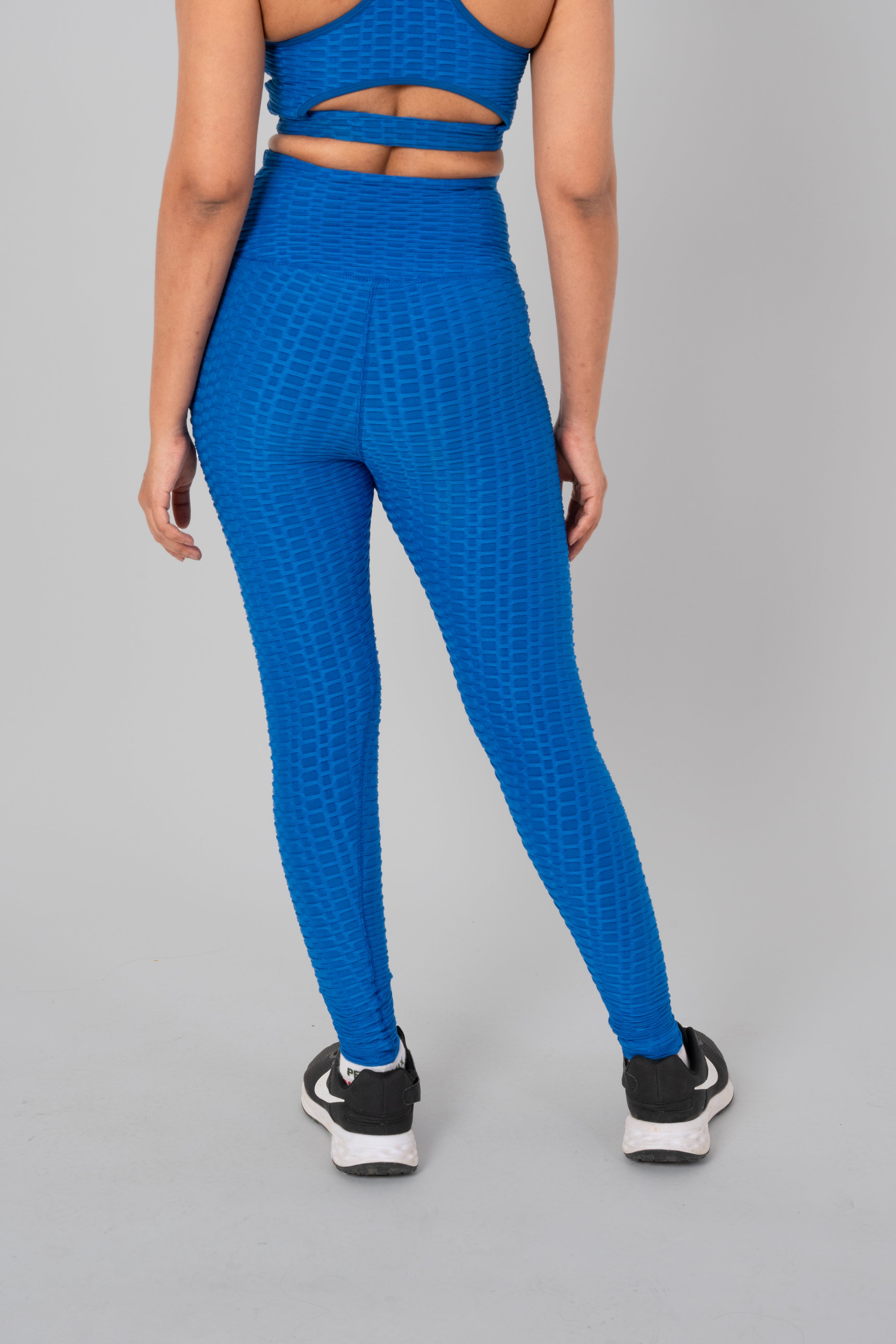 Woman in workout leggings, Teal Blue - back view showcasing and high-waisted support.@@@color_Teal-Blue