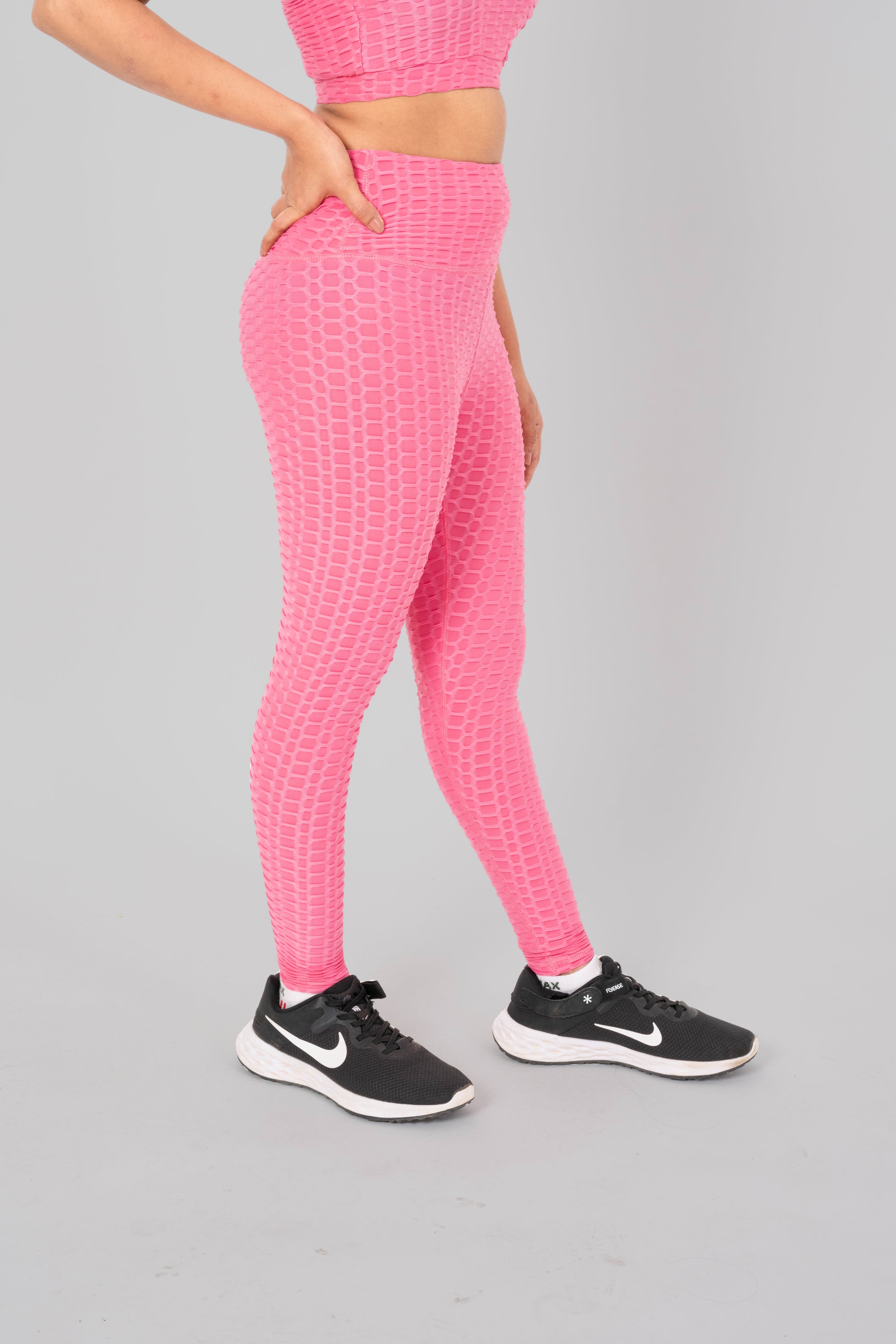 Woman in workout leggings, Pink - side view standing, showing breathable fabric and anti-camel toe feature.@@@color_Pink