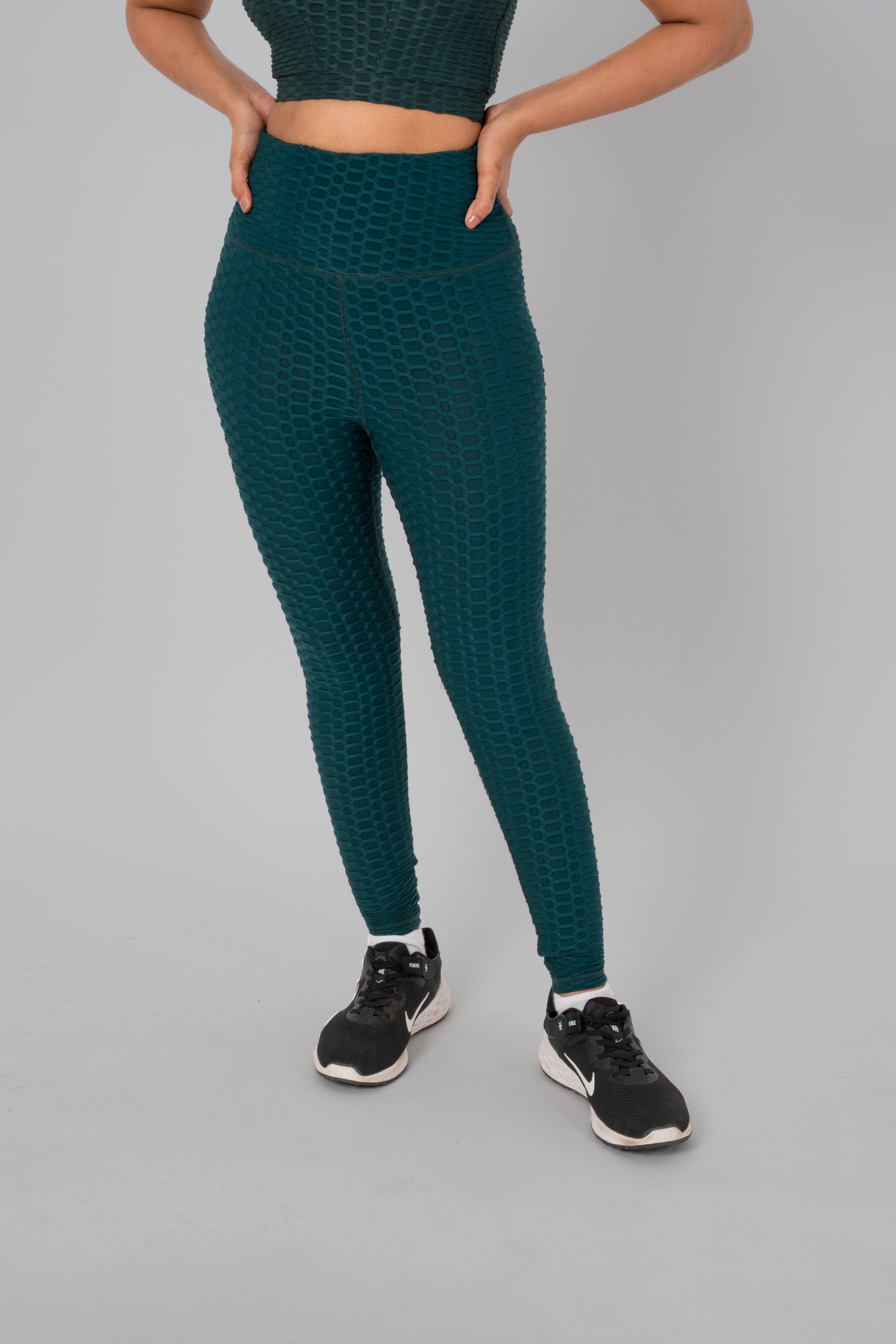 Woman in workout leggings, Bottle Green - front view showing high-waisted fit and anti-camel toe feature.@@@color_Bottle-Green