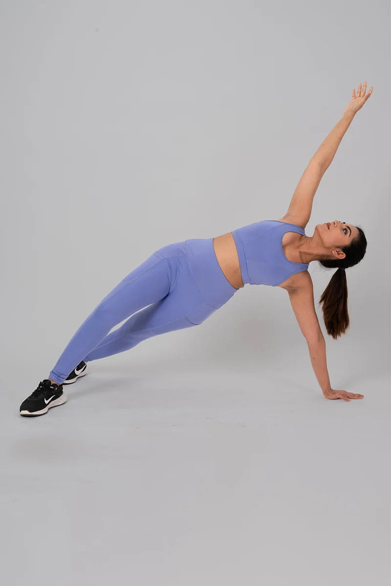 Woman wearing Lilac Anywhere Coord Set stretching in gym workout 