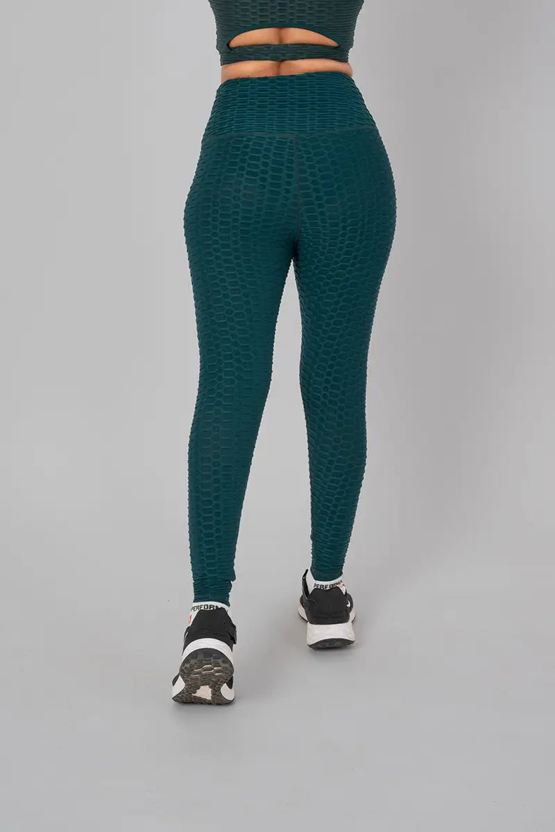 Woman in gym pants for women, bottle green - back view emphasizing anti-slip design and high-waisted fit.