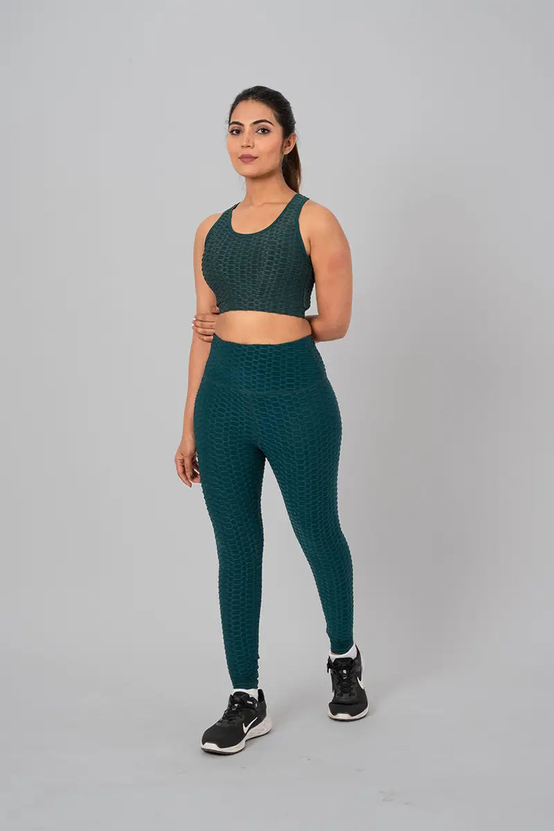 Woman in womens gym wear, bottle green coord set - relaxed front pose showcasing moisture-wicking and zero transparency features.