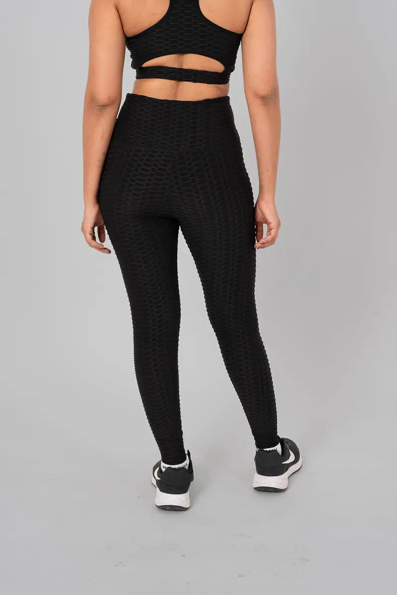 Woman in workout leggings, black - back view showcasing and high-waisted support.@@@color_Black