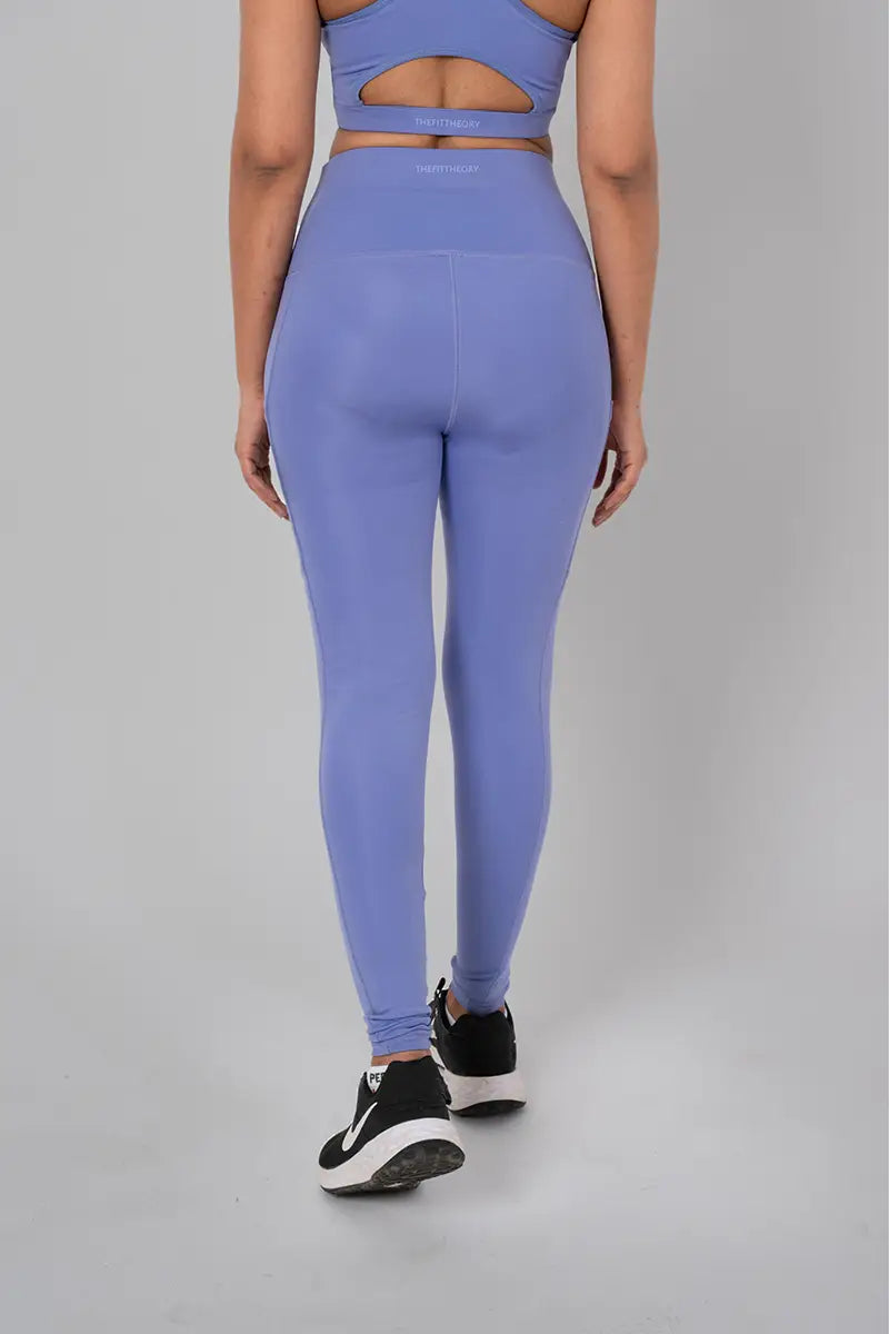 Woman in workout tights for women, lilac - back view showing squat-proof design and high-waisted fit.